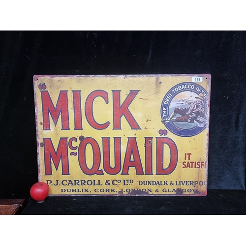 118 - A large printed metal wall sign advertising Mick McQuaid's Tobacco.