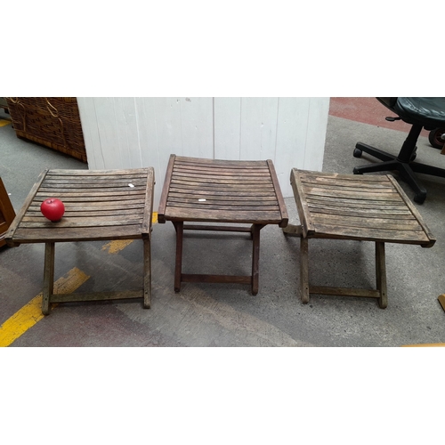 604 - Set of three vintage wooden folding stools with slatted seats. Sturdy construction with a rustic fin... 