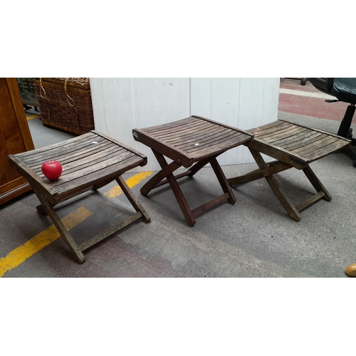 604 - Set of three vintage wooden folding stools with slatted seats. Sturdy construction with a rustic fin... 