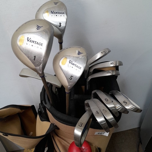 607 - Set of Vantage Vision golf clubs in tan carry bag. Includes 1,3,5 Metal woods and   3, 4, 5, 6, 7, 8... 