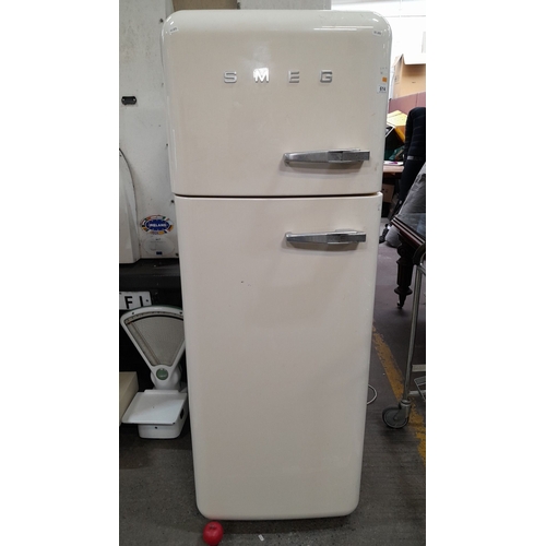 614 - Star Lot : Vintage style  SMEG refrigerator, freestanding model. It has a dual compartment with a to... 