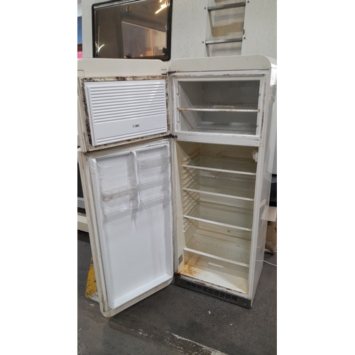 614 - Star Lot : Vintage style  SMEG refrigerator, freestanding model. It has a dual compartment with a to... 