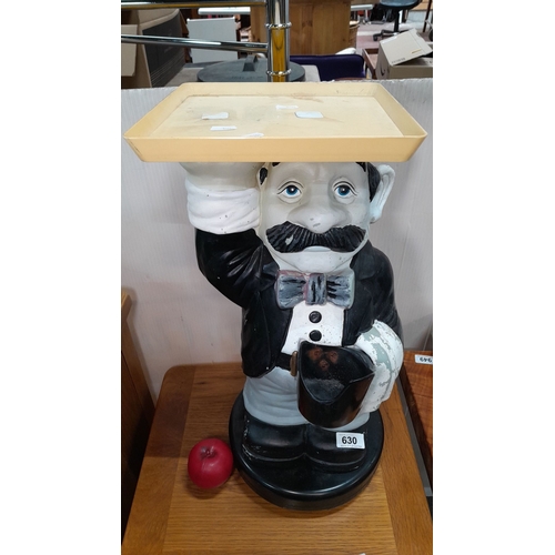 630 - Vintage, hand-painted ceramic butler with a mustache holding a tray. Total height approx. 50 cm.