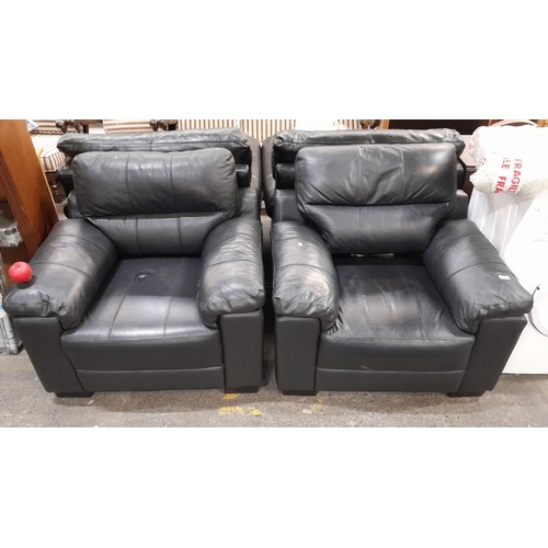 631 - Pair of black leather Saskia armchairs, model WYN4101201. Made in January 2017. Features plush cushi... 