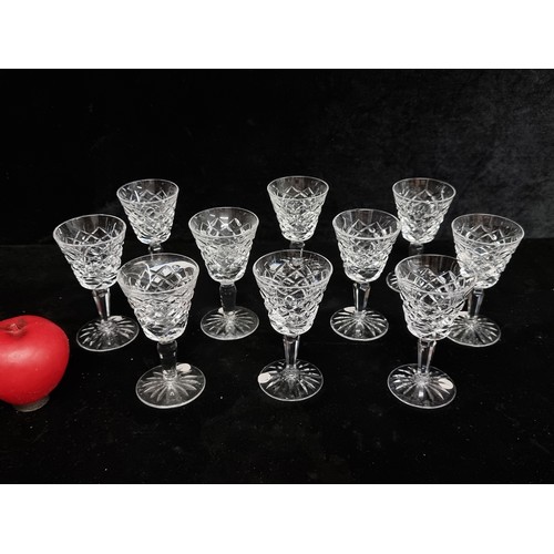 119 - An elegant set of ten 'Waterford' crystal tyrone claret glasses. With acid marks to base. All in ver... 