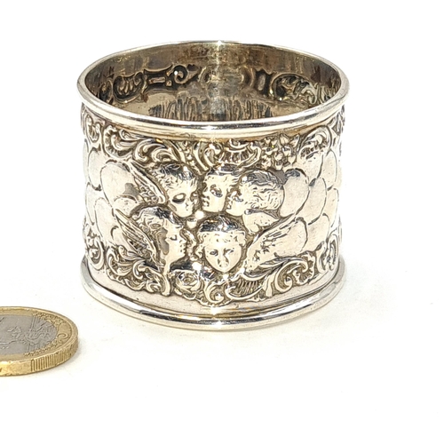 501 - A sterling silver repoussé designed napkin ring. Hallmarked Birmingham. Weight 25.48 grams.