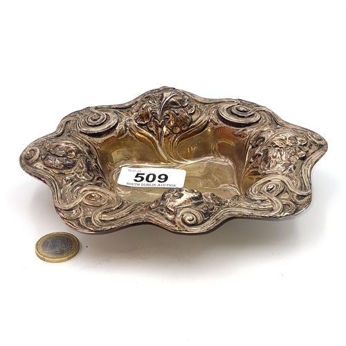 509 - Star Lot : A fine floral repoussé scallop edged tray marked sterling to base. Dimensions 17.14cm. We... 