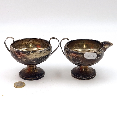 510 - Two items - a sugar bowl and milk jug marked sterling with filled bases. Dimensions for bowl 8cm dia... 