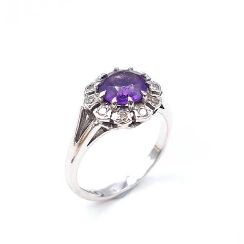 515 - Super Star Lot: An excellent example of a finely polished 18ct white gold amethyst and diamond surro... 