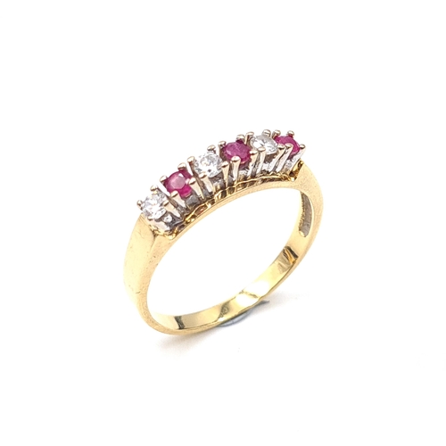 518 - Star Lot: A stunning 18 carat gold ruby and gem stone ring. Size P 1/2. Weight 3.25 grams.