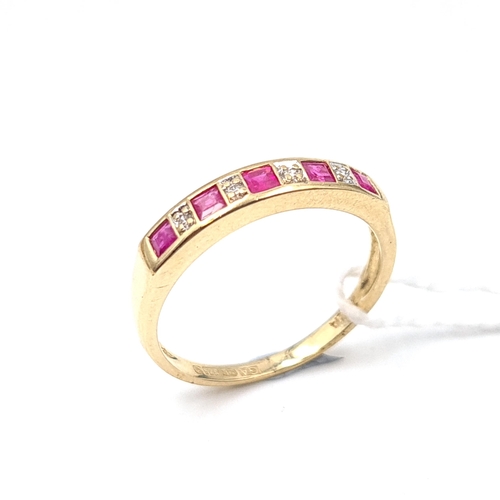 519 - Star Lot: A nine carat gold diamond and pink sapphire ring. Size M. Weight 1.7 grams.