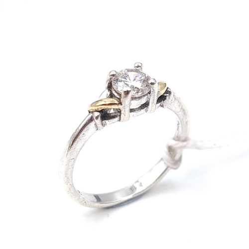 523 - A nice example of a sterling silver and nine carat gold gem set ring. Weight 2.17grams. Size L.