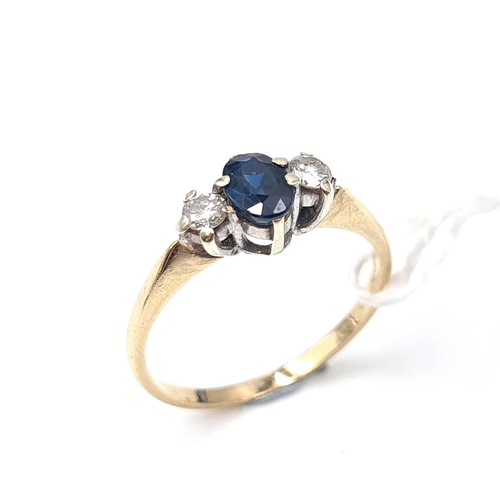 524 - A nine carat gold diamond and sapphire stone ring. Ring size N. Weight 1.8 grams.