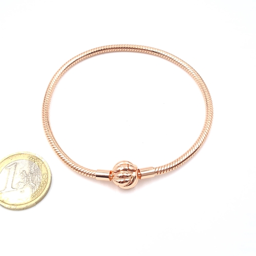 529 - A silver rose gold coloured bracelet. Weight 13.85 grams. Old new stock.