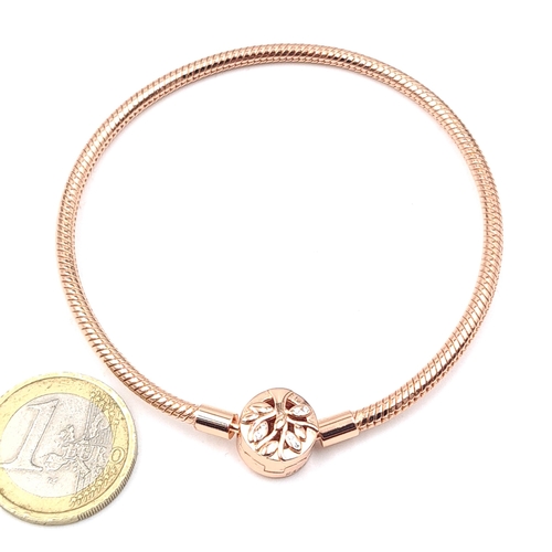 530 - A silver rose gold coloured bracelet. Weight 14grams. Old new stock.