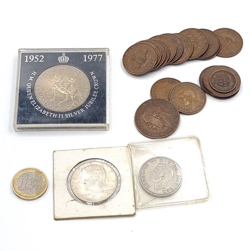 546 - A collection of coins consisting of a 90% 1964 Kennedy half dollar, a commemorative Elizabeth II Jub... 