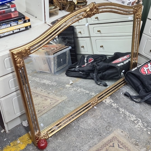 717 - Star Lot : Ornate large  Over mantle  mirror with gold-painted wooden frame featuring decorative flo... 