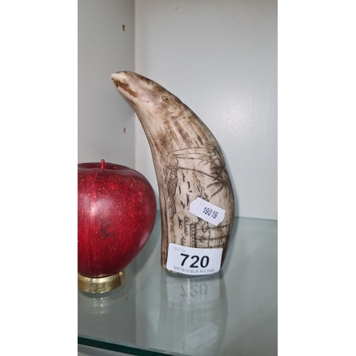 720 - A scrimshaw style object depiction of nautical scenes and palm trees.