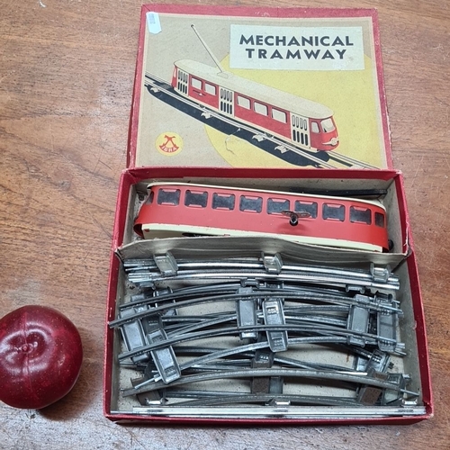 721 - Vintage wind up JEPRA Mechanical Tramway Toy Set. Includes red tram car and metal tracks in original... 