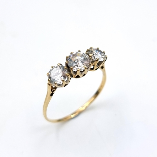 548 - A nice example of a nine carat gold three stone gem set ring. Stones large and bright. Size Z. Weigh... 