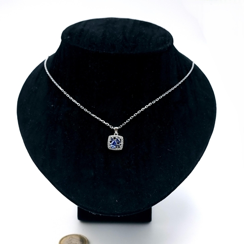 564 - A sterling silver Tanzanite pendant necklace with silver chain. Length 44cm. Old new stock