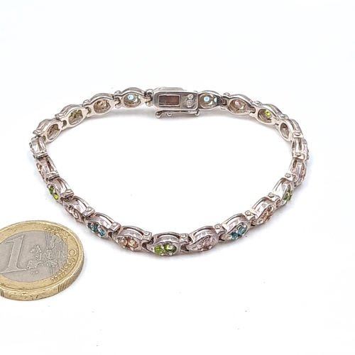 574 - A very pretty Sterling Silver  vari hue multi coloured sapphire bracelet with sterling silver clasp.... 