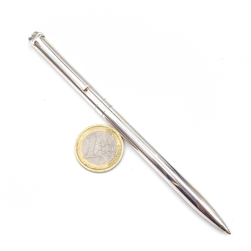 589 - A sterling silver Tiffany ball point pen with Tiffany marked to barrel. Weight of pen 25.35 grams.