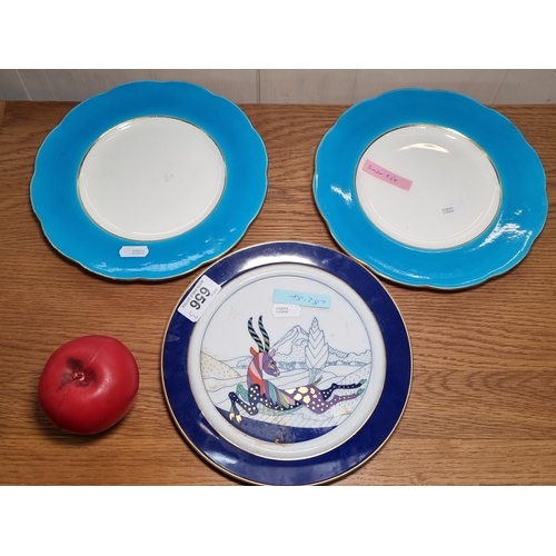 656 - Three porcelain plates, the two Mintons have blue rims while one features an artistic design. The de... 