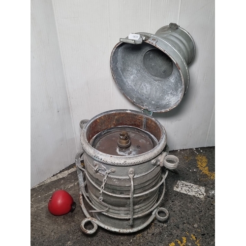 660 - Star Lot : Vintage metal ship's lantern, featuring a robust handle and protective cage, with hinged ... 