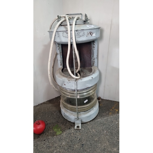 661 - Vintage metal maritime lamp with clear glass lens and attached electrical cables. The embossed word ... 