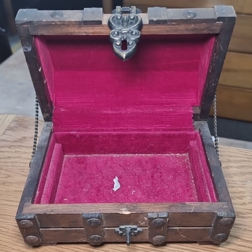 668 - Decorative wooden chest with metal accents and red velvet interior, containing various pins and badg... 