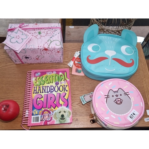 674 - Four items: a Pretty in Pink Bomb Cosmetics box, Cute or What dog washbag, Pusheen round bag, and Th... 