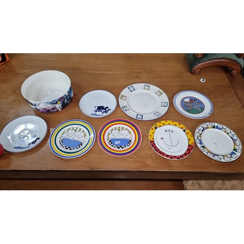 679 - Set of nine ceramic plates and bowls featuring colorful and playful designs. Part of the 