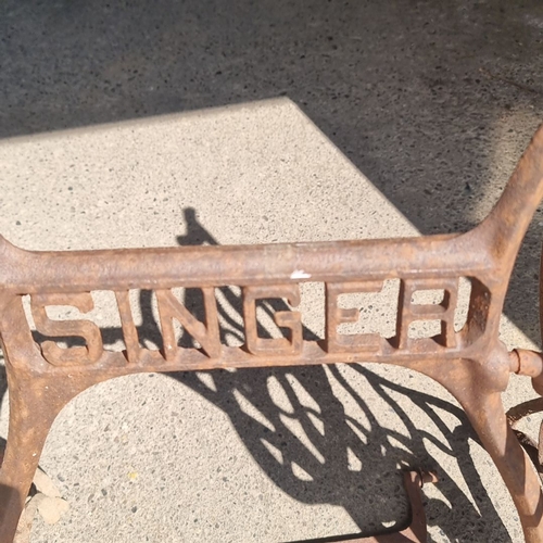 688 - Vintage Singer Sewing Machine Treadle Base, cast iron. Features intricate design and 