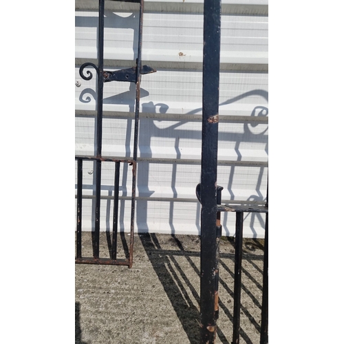 692 - Star Lot : Pair of vintage wrought iron gates with decorative scrollwork. Features an upper arched d... 