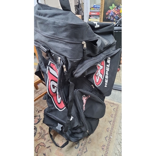 737 - Hespeler Black Sports Equipment Bag with multiple zippered compartments, durable handles, and large ... 