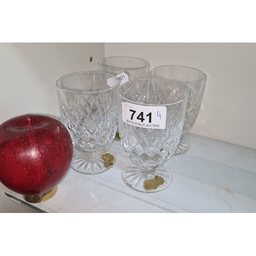 741 - Set of four Waterford crystal glasses with intricate diamond-cut pattern. Includes a large red apple... 