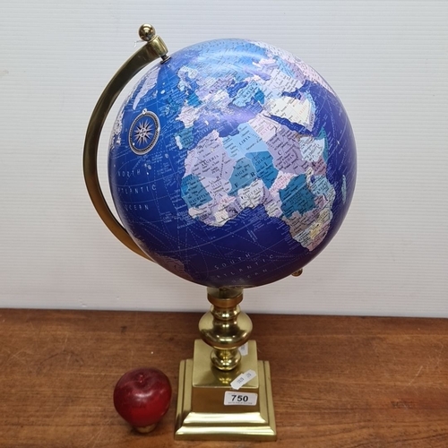 750 - Elegant desk globe with brass stand. Features a blue ocean design and detailed legend. Scale: 1:72,0... 