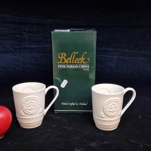 161 - An as new in box set of two Belleek Irish porcelain mugs / cups.