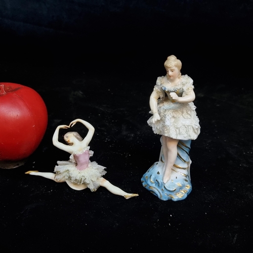 180 - Two pretty porcelain dancing figurines including The ballet dancers marked Irish Dresden but probabl... 