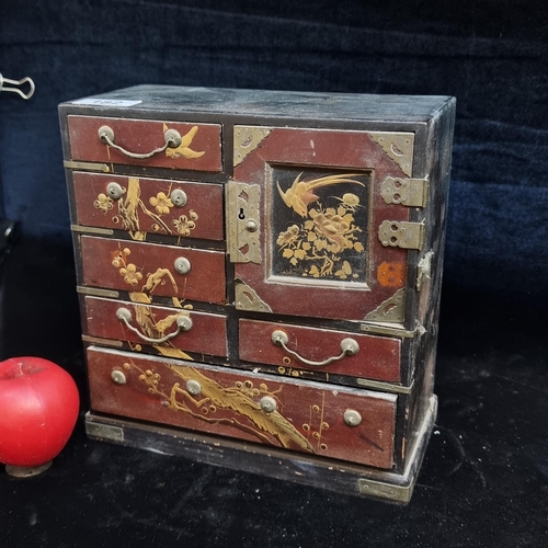 182 - A vintage Japanese Chinoiserie jewellery box with eight separate compartments with metal hardware.