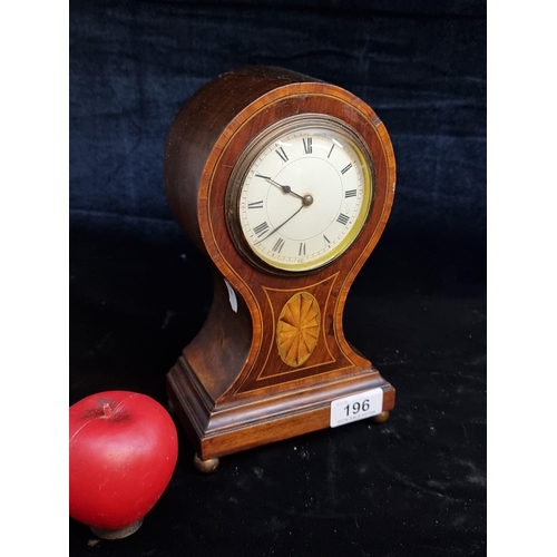 196 - A fabulous shaped early 20th Century mahogany balloon head mantle clock boasting beautiful marquetry... 