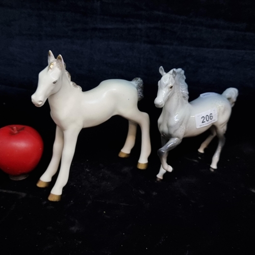 206 - Two horse figurines including a grey Beswick example.