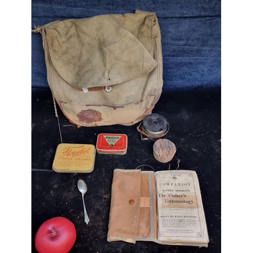 220 - A good vintage fishing bag, With boxes for flys and a fishing book.