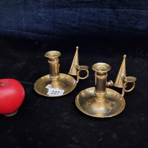 227 - A pair of vintage brass adjustable chamber candle holders with candle snuffers.