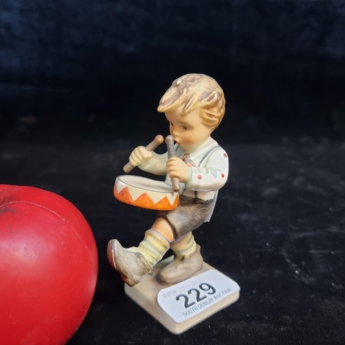 229 - A sweet Goebel figure of a young drumming boy.