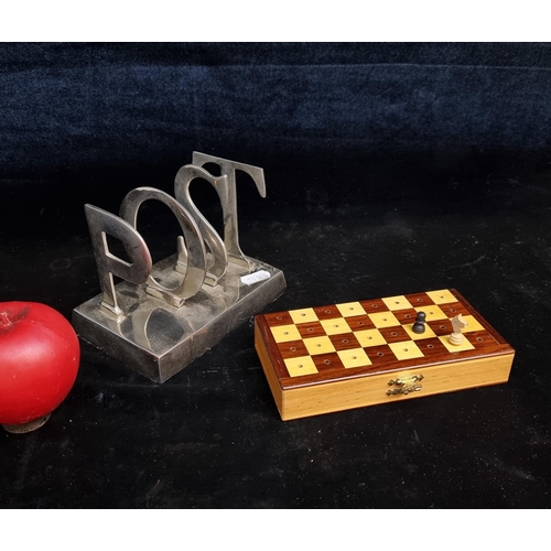 238 - Two items including a neat travel chess set  with 32 pieces along with a solid chrome Post rack.