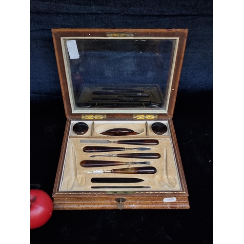 239 - A gorgeous antique gentleman's vanity kit housed in a smart wooden travel case with glass topped lid... 