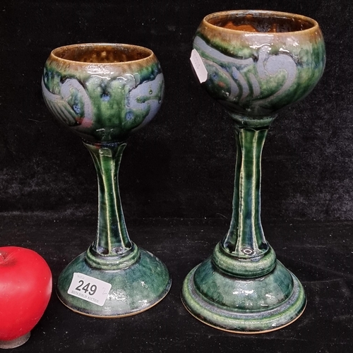 249 - A pair of tall two tone  art studio pottery drinking goblets. Marked to base. Very much in the Art N... 