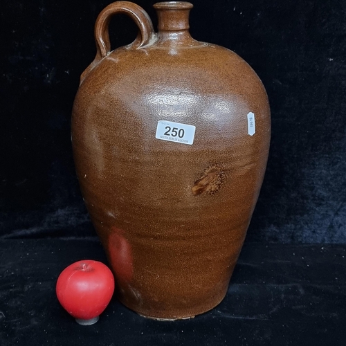 250 - A large stoneware flagon marked 